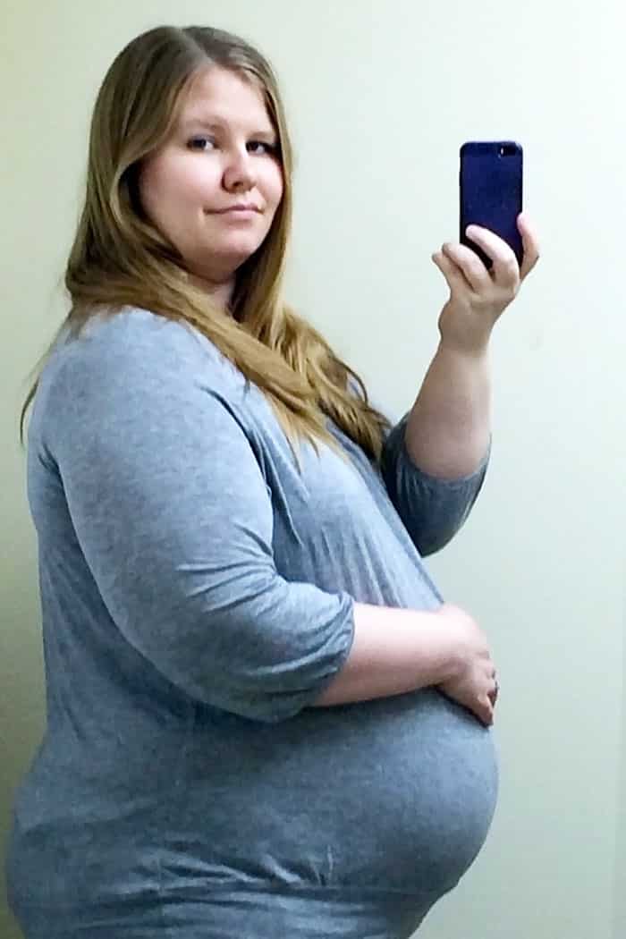 baby bump week 33 pregnant obese woman photo