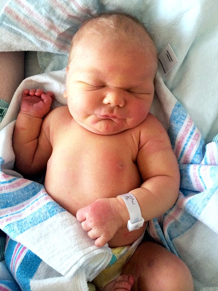 newborn baby girl with fat rolls photo