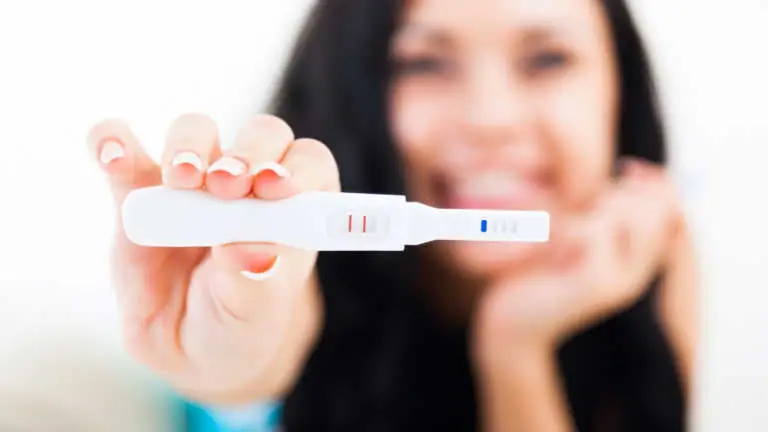 positive pregnancy test smiling happy photo