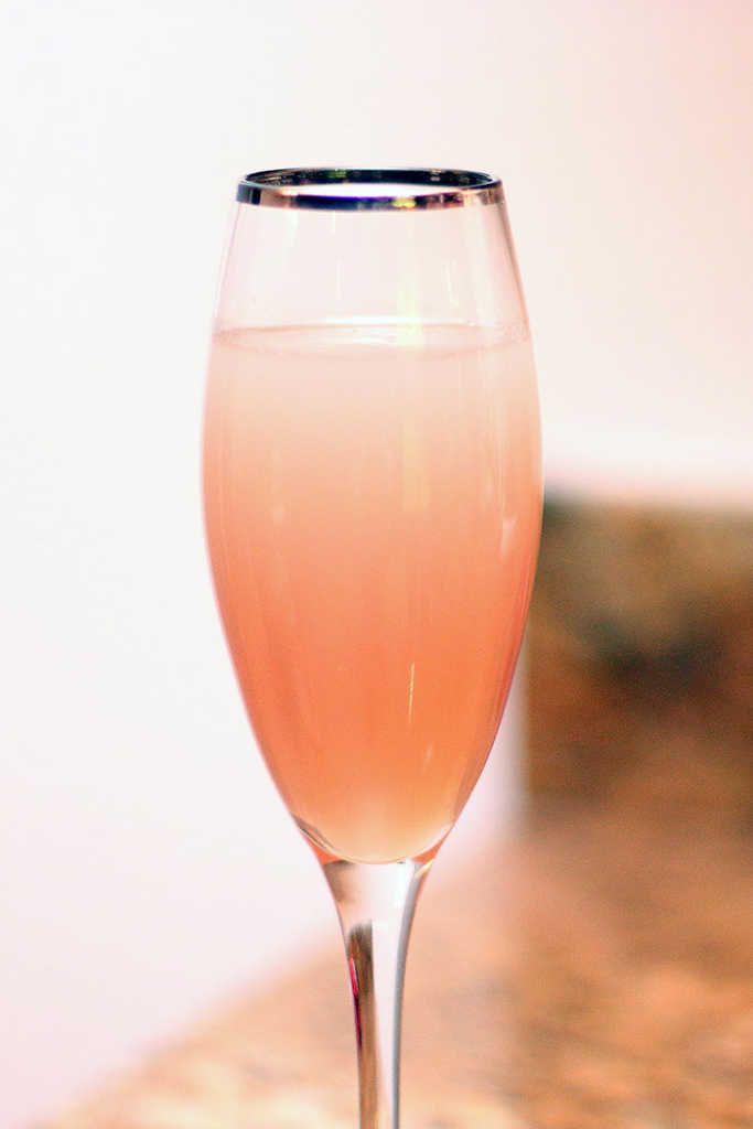 absinthe and pink champagne in a glass