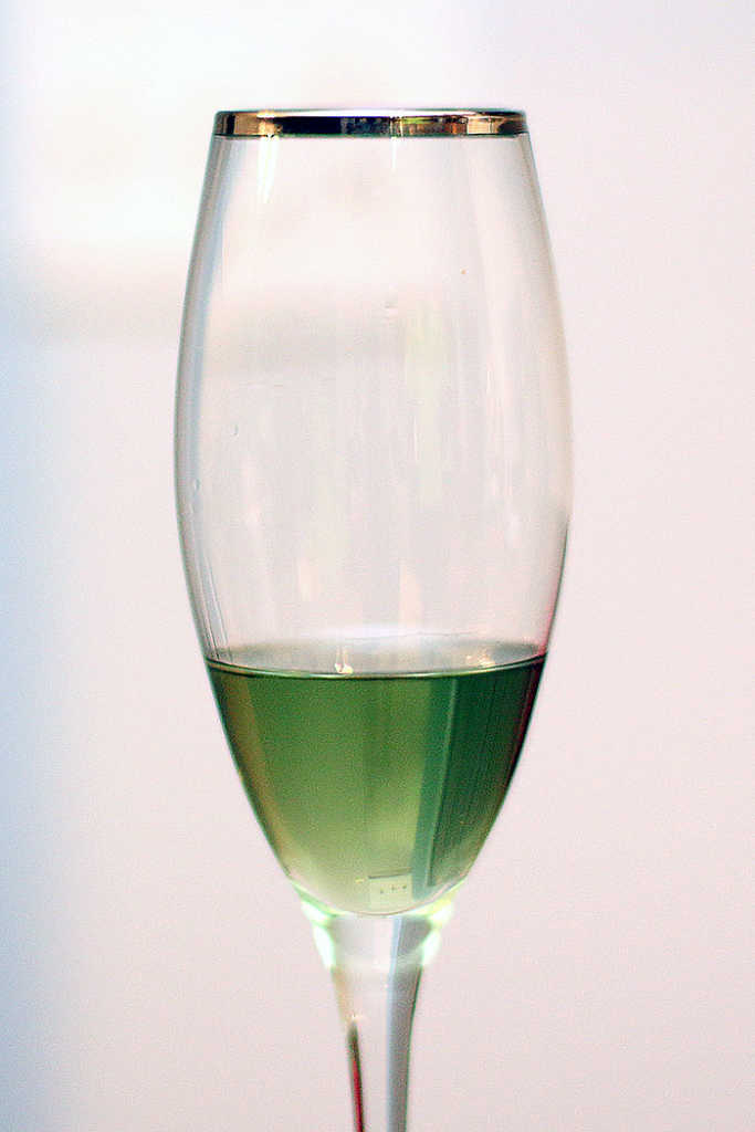 green absinthe in a champagne glass