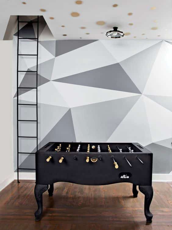 grey and white geometric design painted on the wall