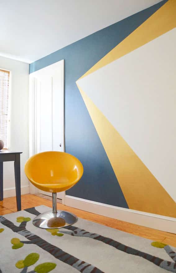 geometric triangle design pointing on wall