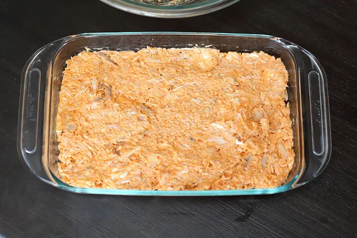 pyrex dish with buffalo chicken dip spread