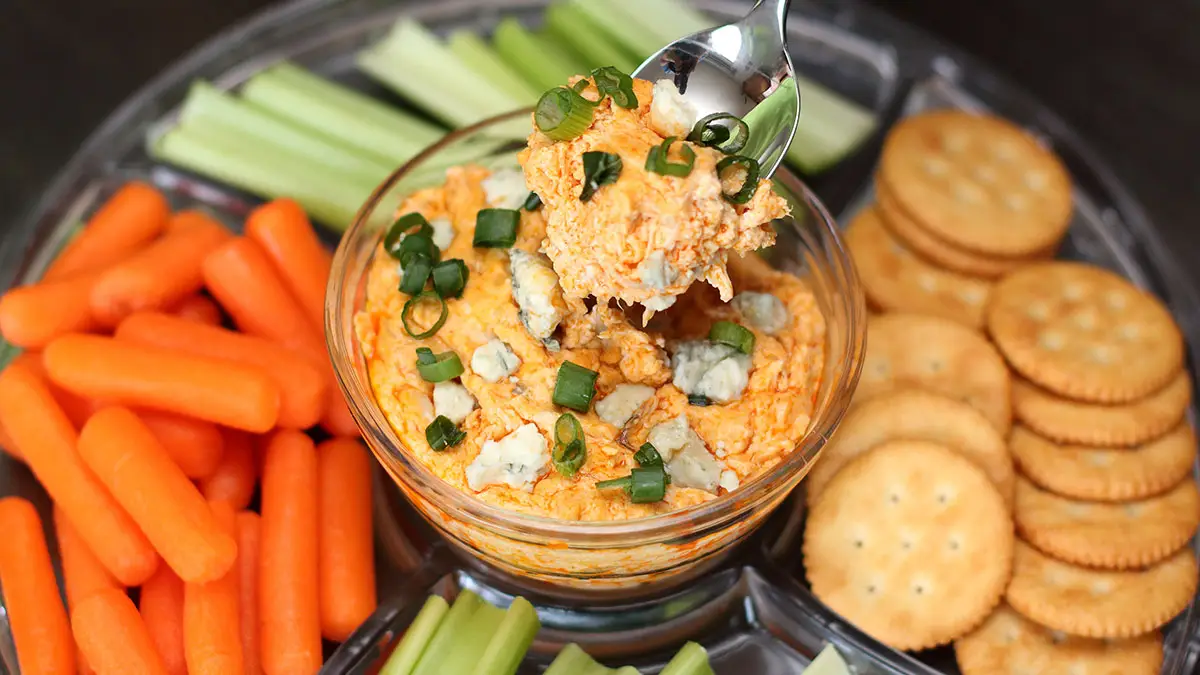 super bowl buffalo chicken dip platter with spoon dip