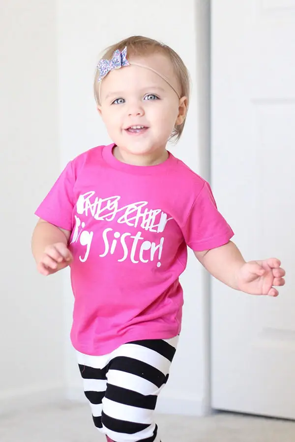 toddler girl wearing big sister shirt