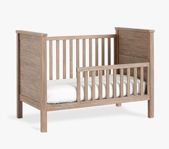 crib converted to toddler bed with toddler rail