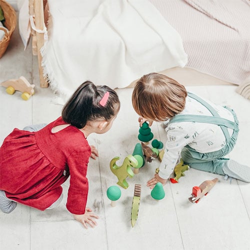 toddlers playing in Montessori bedroom