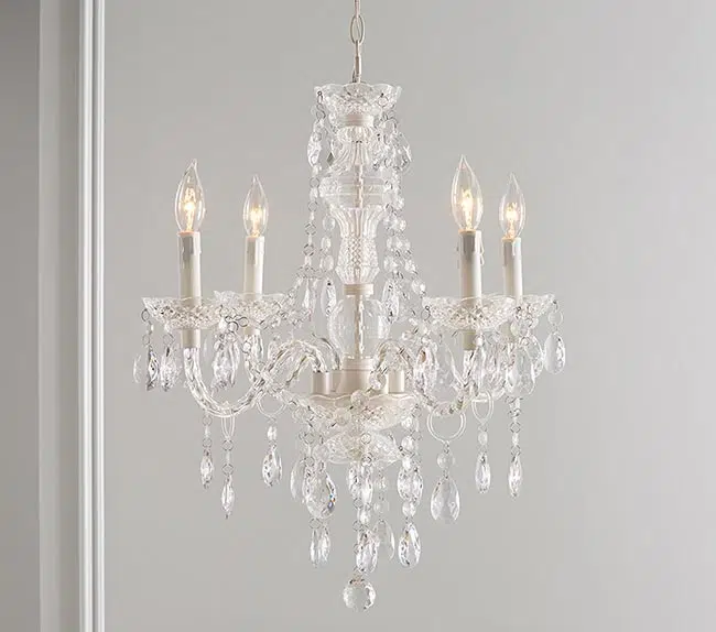 a small white traditional chandelier