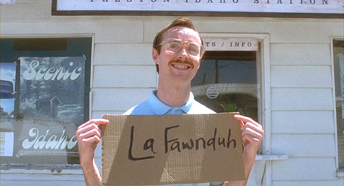 kip from napoleon dynamite with braces holding lafawnduh sign