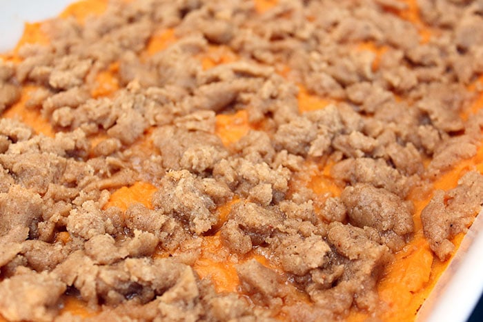 streusel cooking on top of mashed sweet potatoes