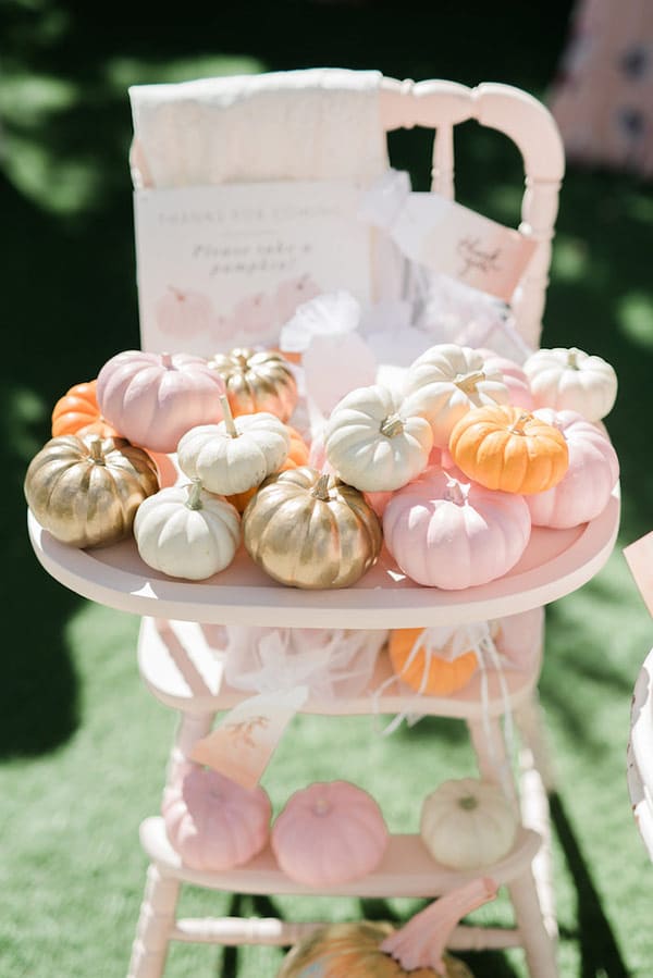 pumpkins in a high chair as baby shower party favors