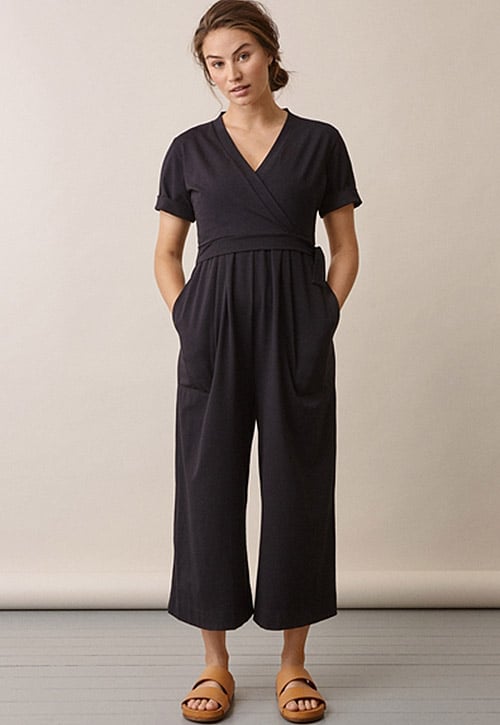 woman wearing a black maternity jumpsuit with pockets