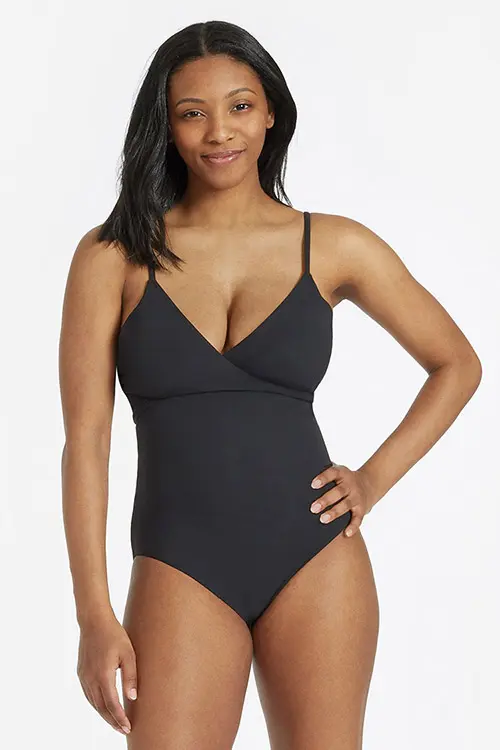 woman wearing a black one-piece swimsuit