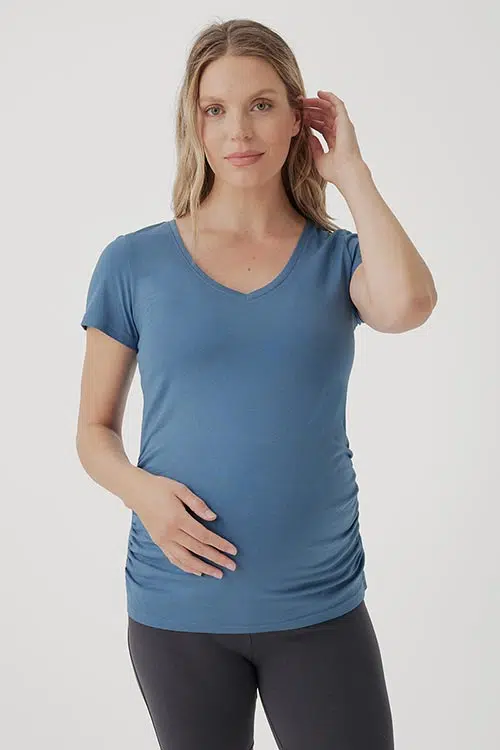 woman wearing a blue maternity v-neck shirt