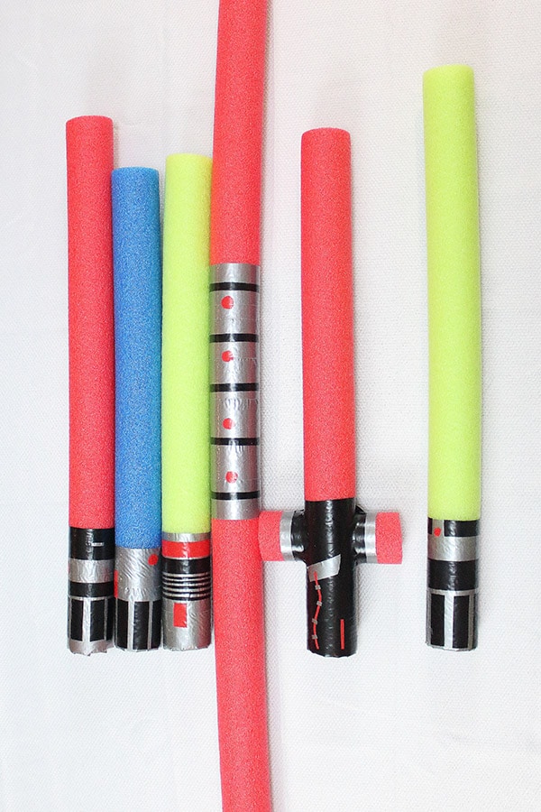 Star Wars character lightsabers made out of pool noodles