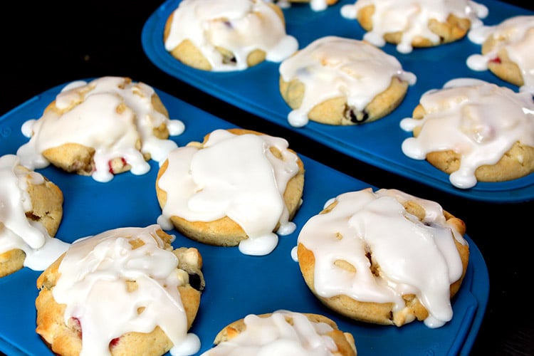 glazed red, white and blue muffins still in silicone pans