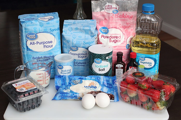 the ingredients used for red, white and blue muffins including blueberries, strawberries, and white baking chips