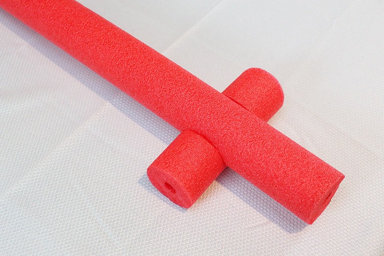small pool noodle piece wedged into a larger one after having portions cut out