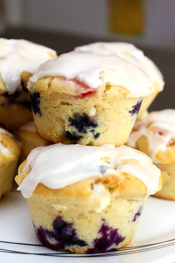 glazed red, white and blue muffins stacked on a plate