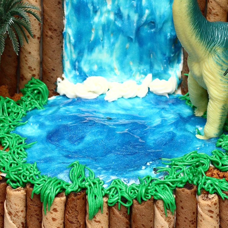 closeup of a cake that looks like it has a pool of water on it