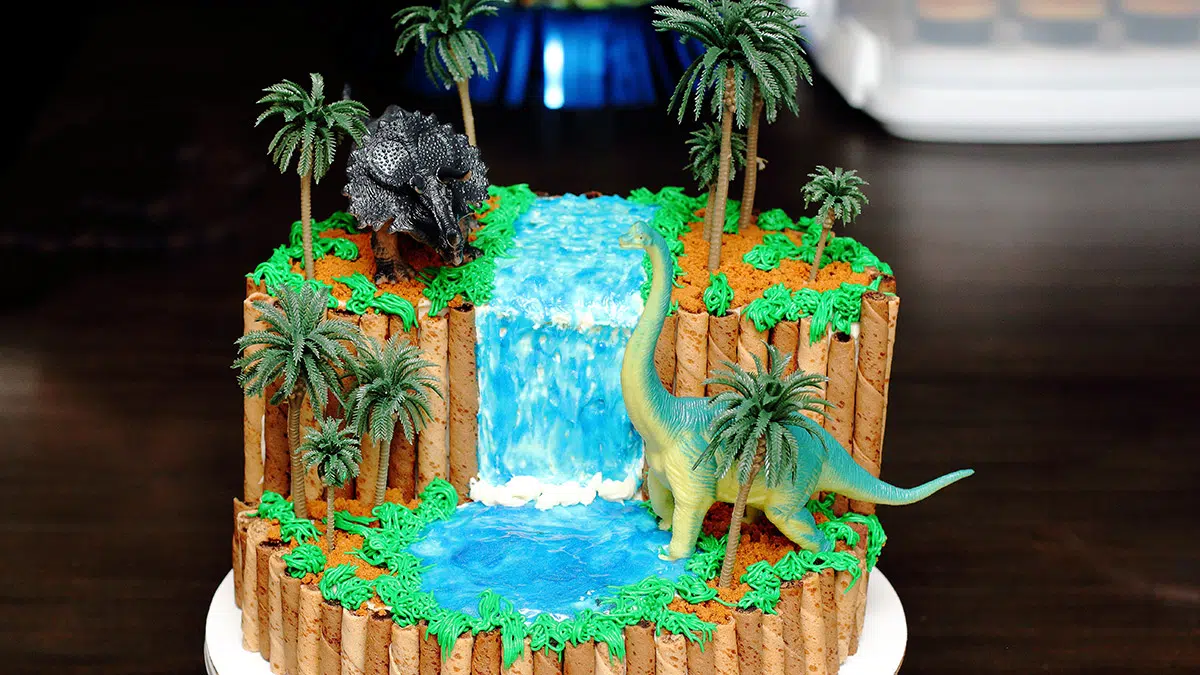 a realistic-looking dinosaur birthday cake that uses simple steps to create