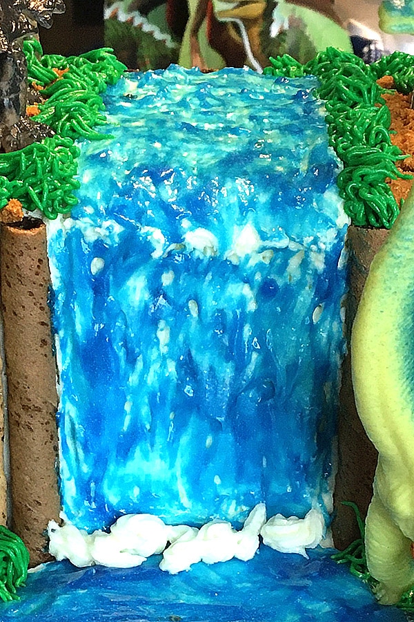 icing waterfall made with buttercream frosting and Wilton blue sparkle gel painted on top