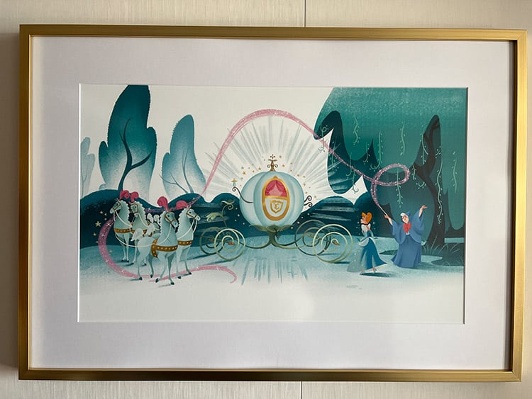 Cinderella art hanging on the wall of a Disney Wish stateroom