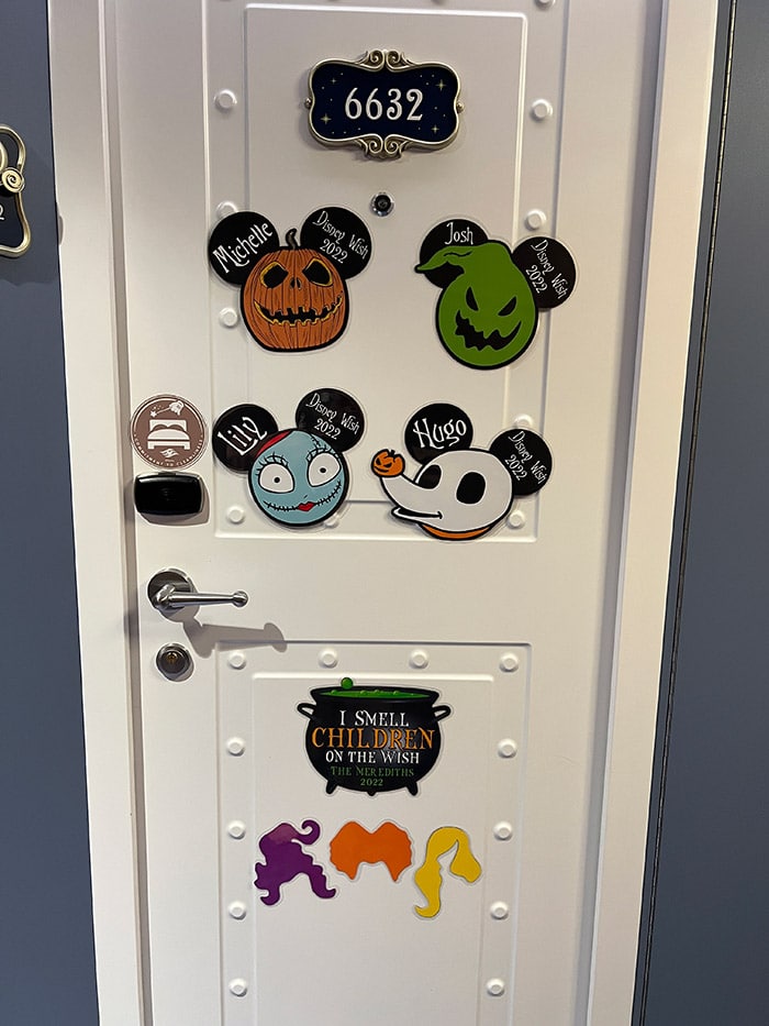 Disney Wish cruise stateroom door decorated with Nightmare Before Christmas and Hocus Pocus magnets for a Halloween on the High Seas cruise
