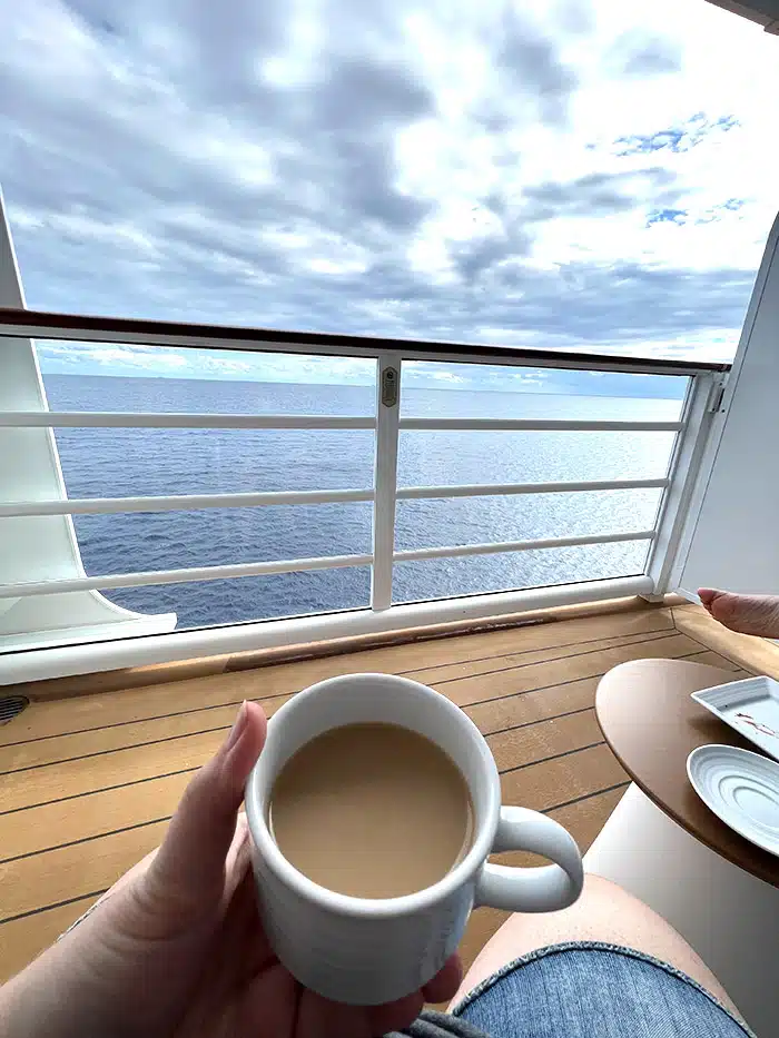 point of view of drinking coffee on a large private cruise ship verandah