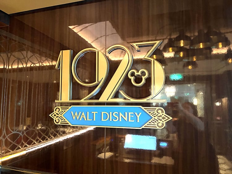the 1923 Walt Disney side restaurant sign on the Disney Wish cruise ship