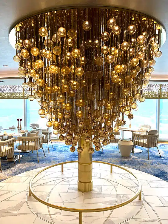 the focal centerpiece chandelier inside Enchante on the Disney Wish