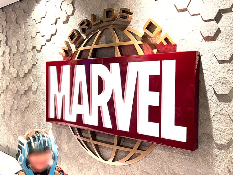 the Worlds of Marvel restaurant sign on the Disney Wish cruise ship