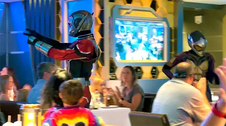 Ant-Man and the Wasp walking through the Worlds of Marvel restaurant on the Disney Wish