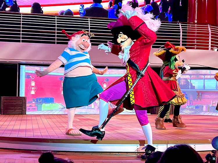 Captain Hook and Mr. Smee prancing across the stage at Mickey's Pirates in the Caribbean Party