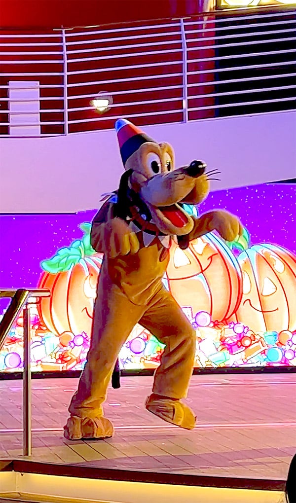 Pluto wearing a candy corn hat and collar during Mickey's Mouse-querade party