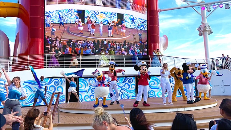 a photo taken during the Set Sail on a Wish deck party on board the Disney Wish cruise ship