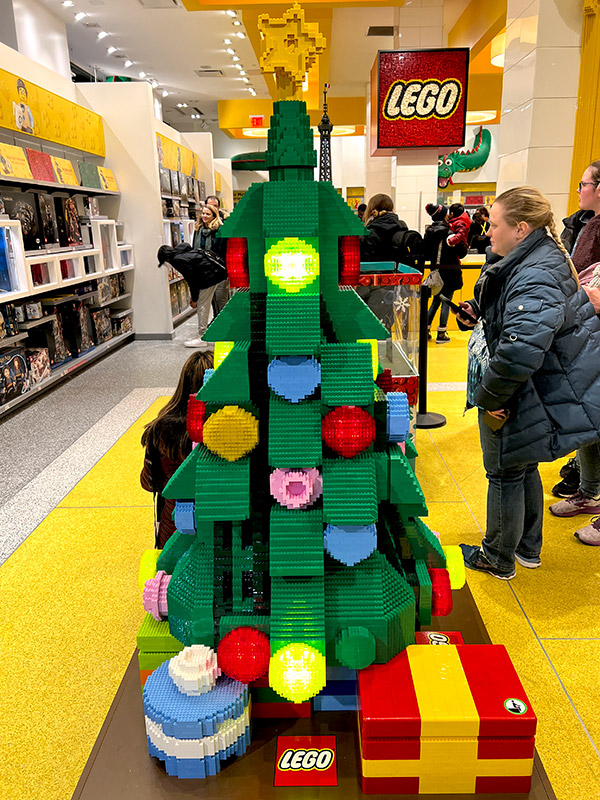 a Christmas tree made entirely out of LEGOs featured in the Flatiron LEGO Store in NYC