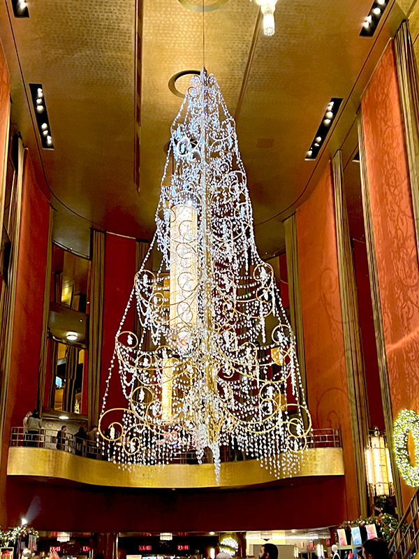 a suspended Christmas tree made entirely of crystal in the lobby of Radio City Music Hall