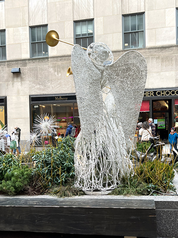 a herald angel made of Christmas lights in Rockefeller Plaza