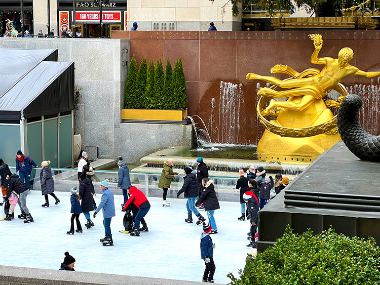 The Rink at Rockefeller Center with people ice skating at Christmas time
