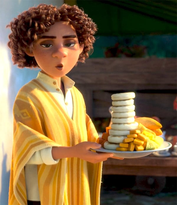 scene from Encanto when Camilo shapeshifts back to himself from Isabela while carrying a plate piled high with food, including arepas and empanadas