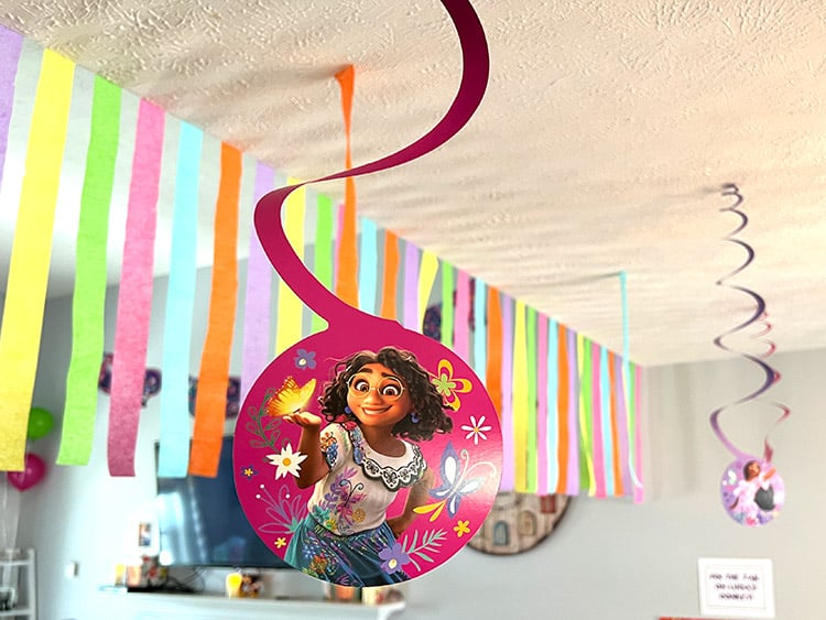 closeup of a hanging ceiling swirl featuring Mirabel from Encanto