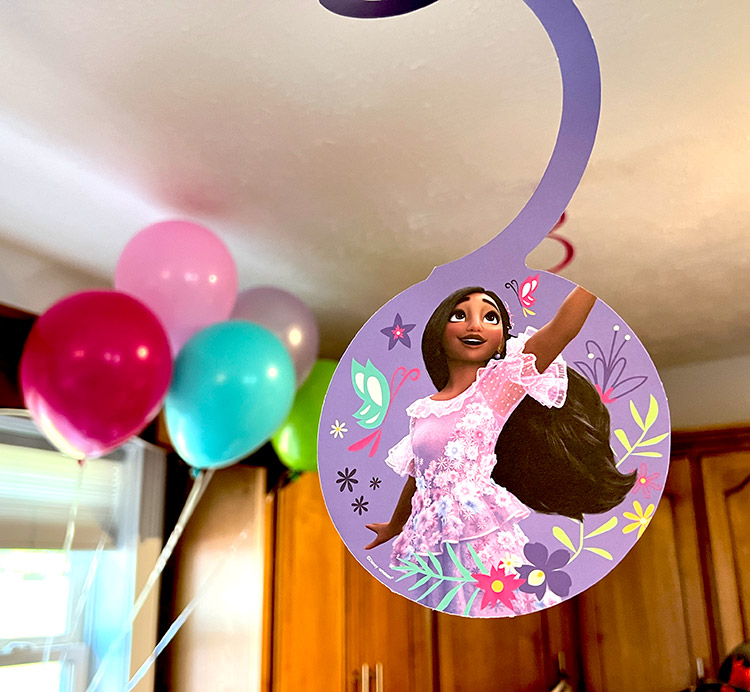 hanging spiral featuring Isabela from Encanto with birthday balloons in the background