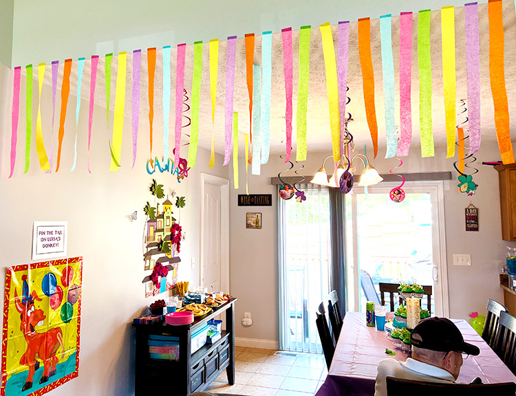 wide shot of a kitchen decorated for an Encanto birthday party