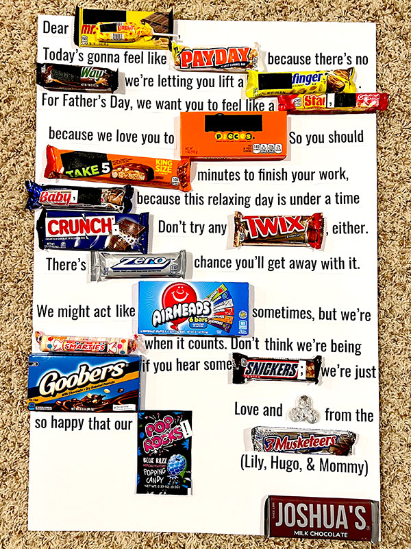 a completed Father's Day candy board with text and twenty types of candy