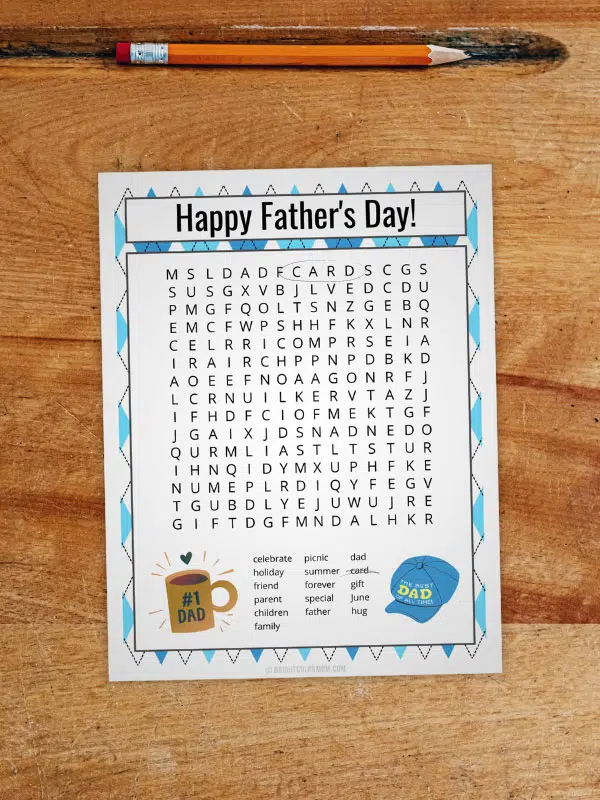 a student desk with a pencil in the top divot and a printed Father's Day word search on the desk