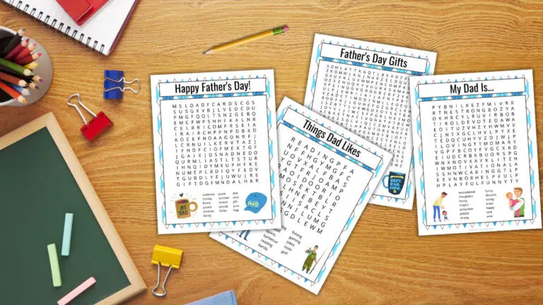 aerial view of a student desk covered in four printed Father's Day themed word searches in varying difficulties