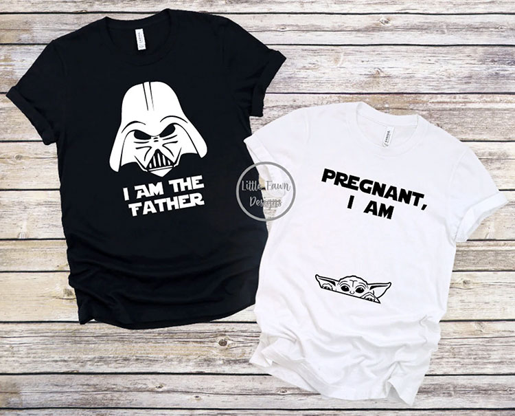pair of coordinating pregnancy t-shirts with the father's shirt in black featuring Darth Vader from Star Wars and the text "I am the Father" while the mom's shirt is white with the text "Pregnant, I am" and a baby yoda peeking out near the belly area