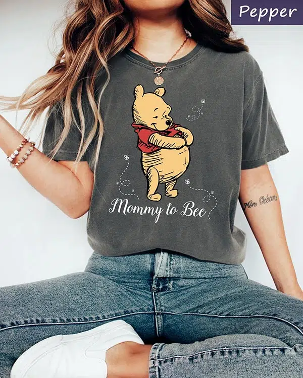 Winnie the Pooh on a shirt that says Mommy to Bee